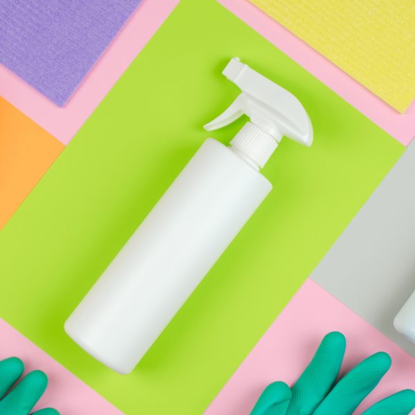 Cleaning products on a pink background.
